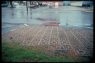 Concrete lattice installed in gas station parking lot