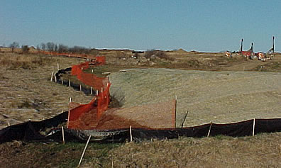 An example of a properly installed silt fence